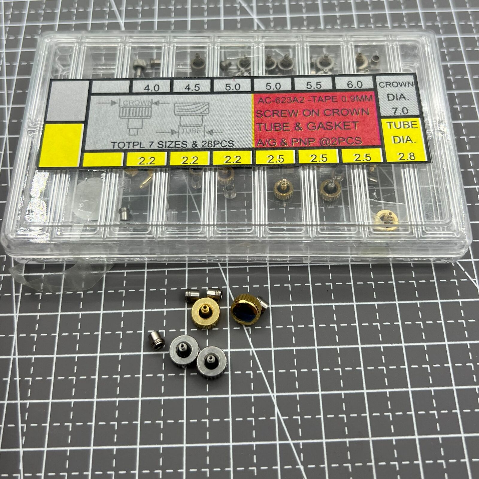 Stainless steel screw-on watch crown with gasket in silver and gold tones, durable replacement part.