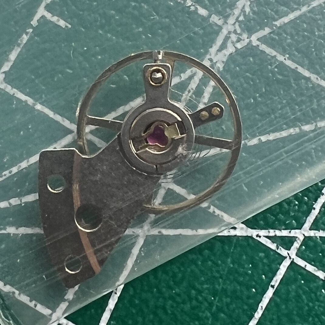 Precise Mingzhu 2813 8205 balance wheel with splint for watch movement repair and replacement.