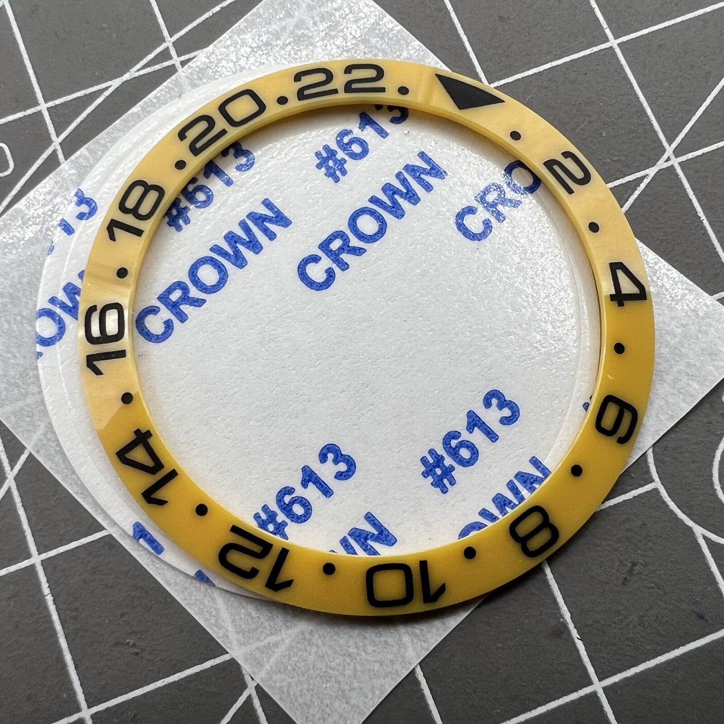 38mm ceramic Slope GMT bezel ring with black font for SUB007 watch, vibrant yellow background.