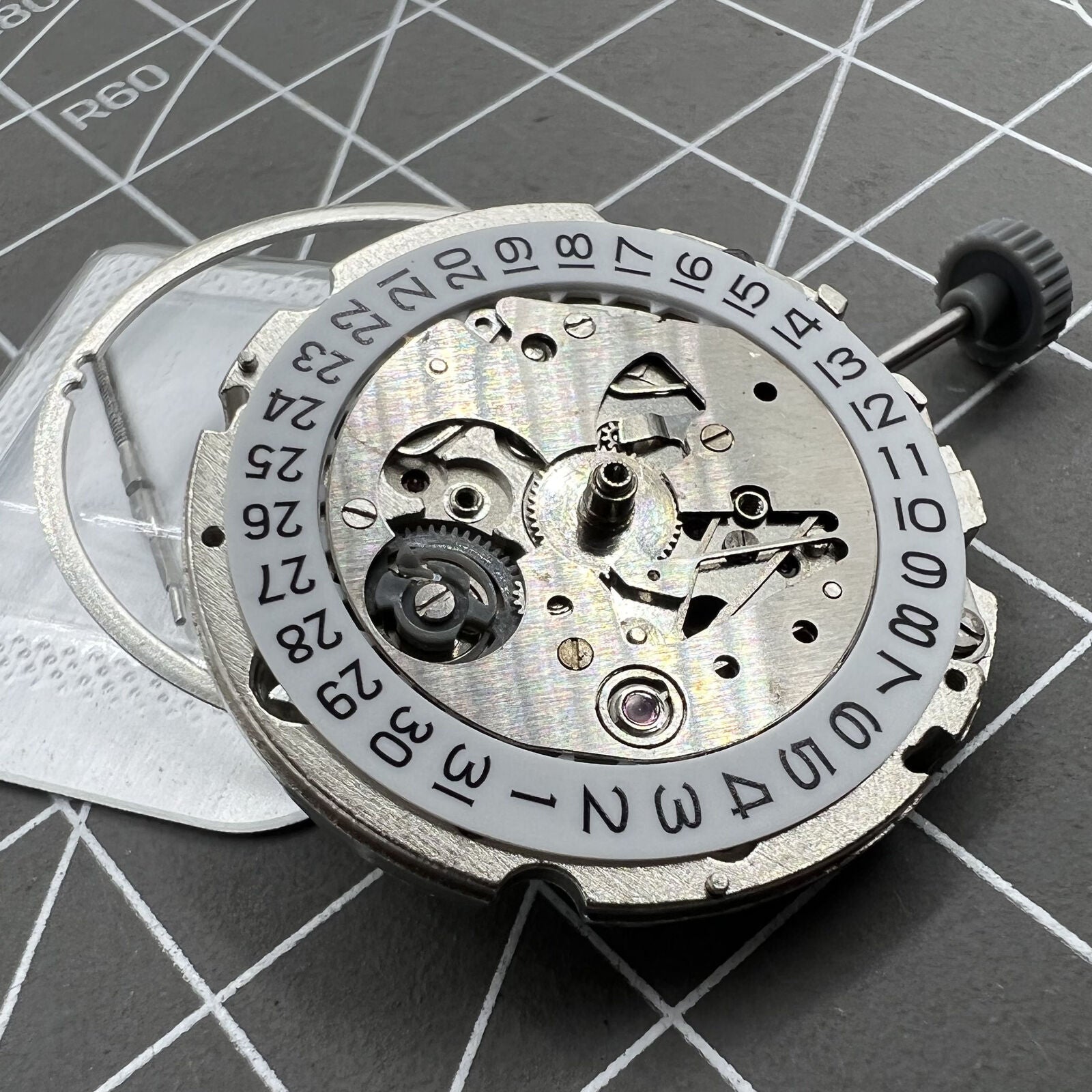 Miyota/Citizen 8200 series watch movement with single calendar date at 6 o'clock, precision timekeeping.