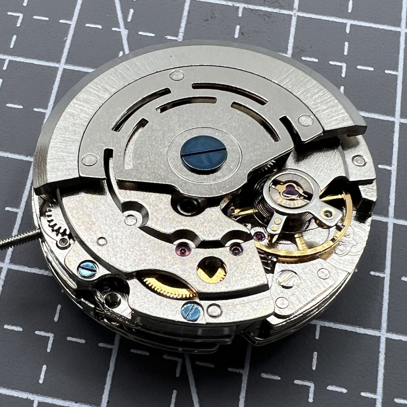 DG2813 automatic mechanical watch movement showcasing three large hands and a small seconds dial at 6 o'clock.
