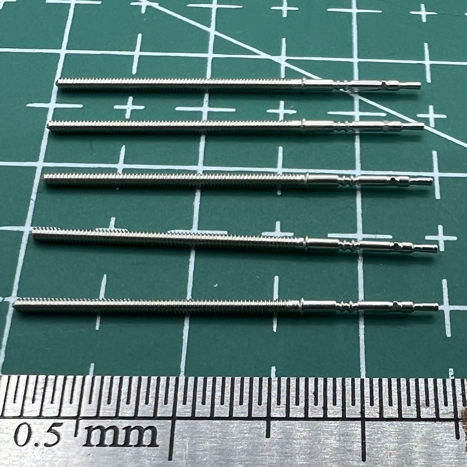 Wholesale lot of durable PE90-compatible watch winding stems for precise watch repairs.