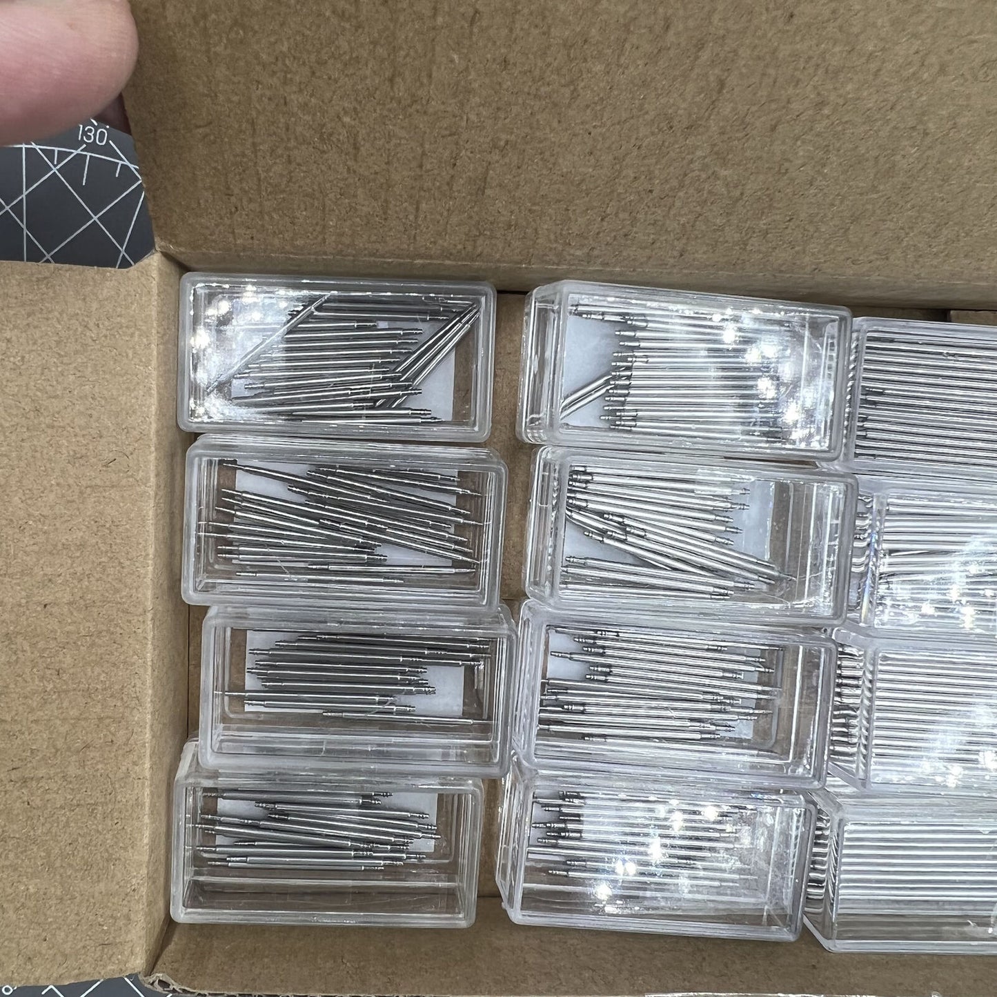 Set of 260 AB-605EL150 stainless steel extra long spring bars, 1.5mm diameter, ideal for watch strap replacements.