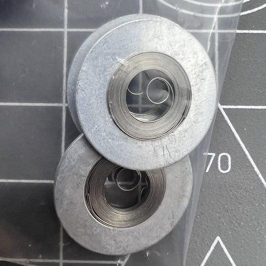 Ressort moteur argenté générique adapté au mouvement 7009#180