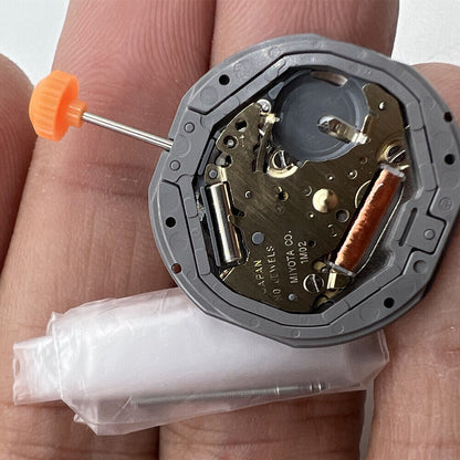 Miyota 1M02 quartz watch movement showing 3 hands with date and day display at 3 o'clock.