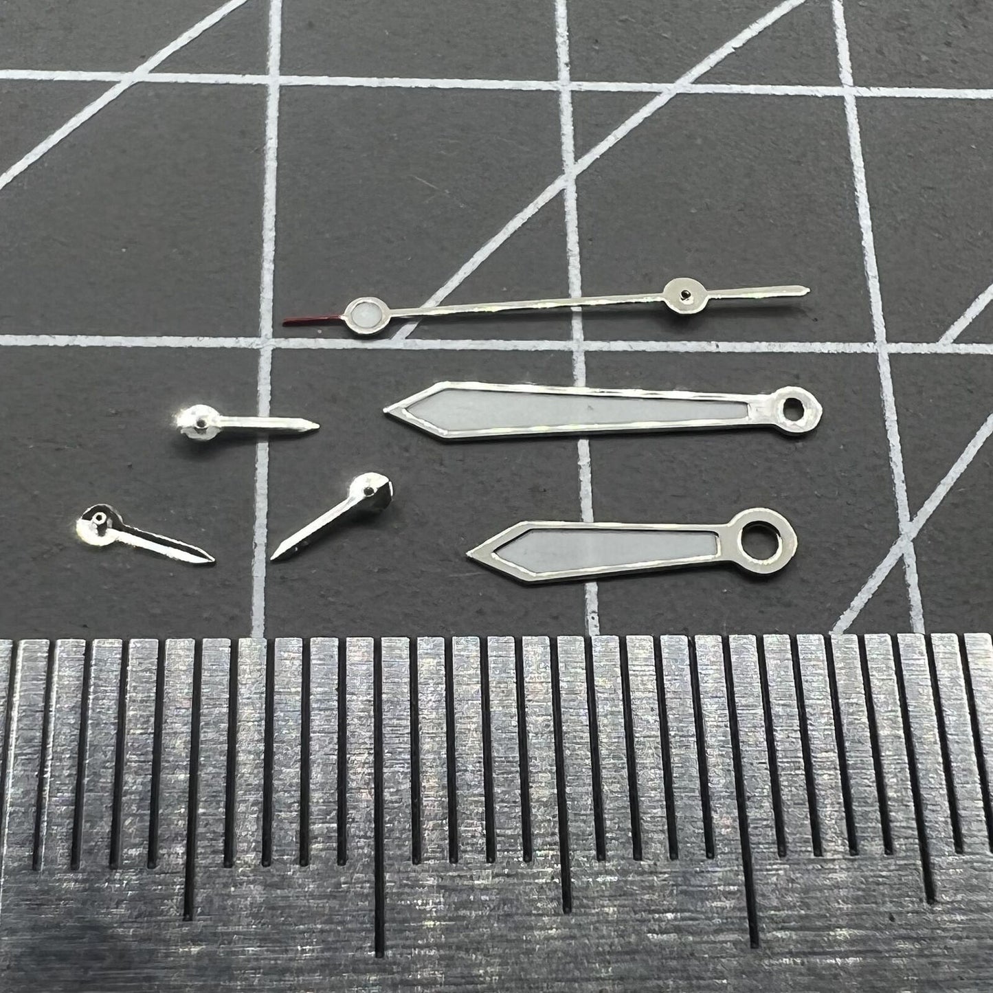 Arrow-shaped 13mm green lume watch hands with silver trim for VD53 VD54 VD57 movements.