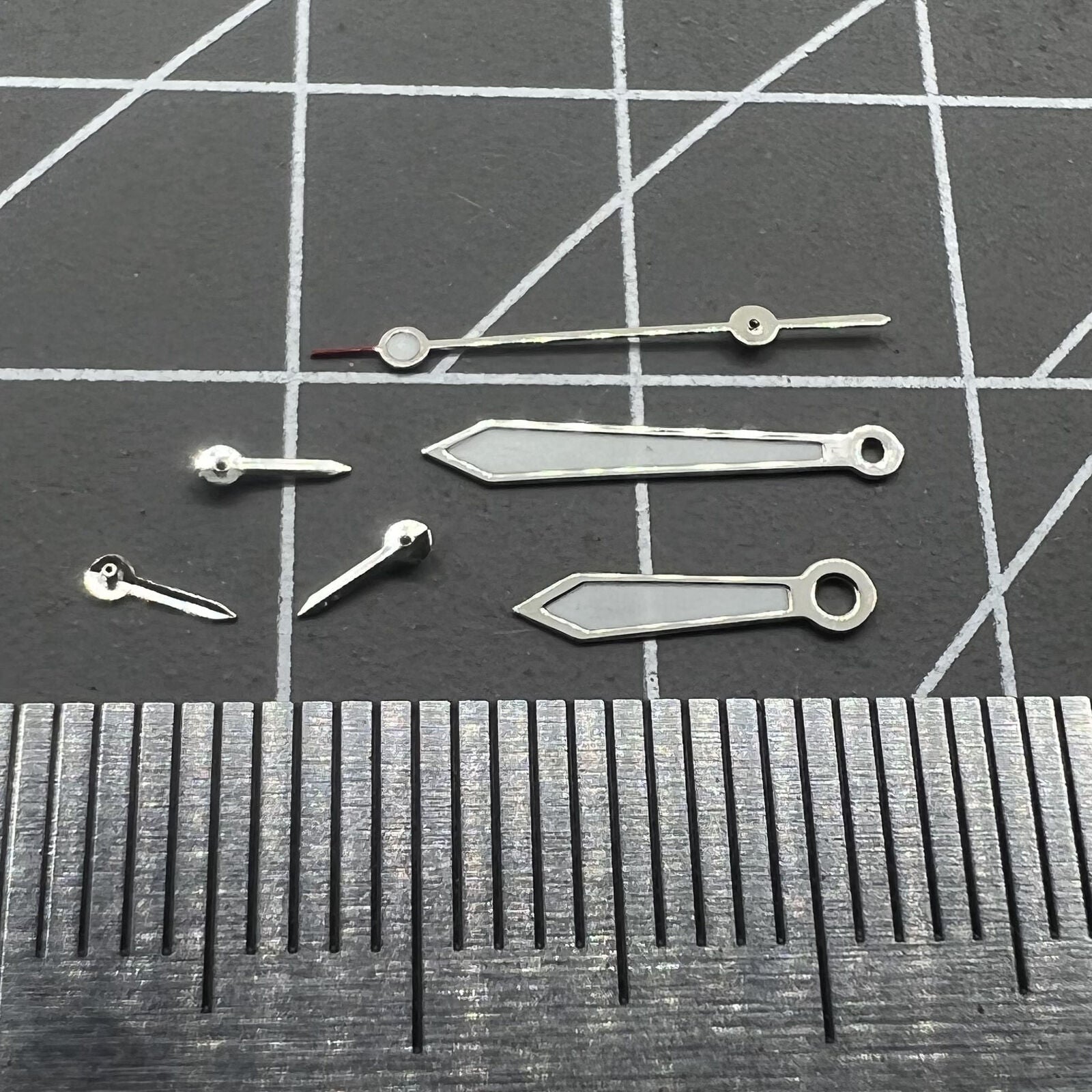 Arrow-shaped 13mm green lume watch hands with silver trim for VD53 VD54 VD57 movements.
