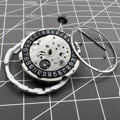 Miyota/Citizen 8215 watch movement with black dial and date at 6, automatic mechanical for precision timekeeping.