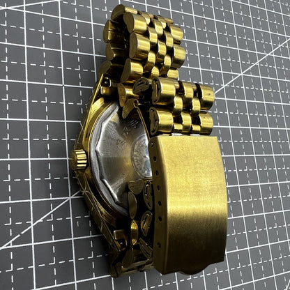 38mm Wudang Steel mechanical watch featuring golden dial, single calendar, 17 jewels, and elegant design.