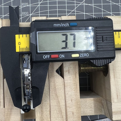 Miyota 6S10 quartz watch movement showing small seconds at 6, 9, 12 o'clock and date at 3.