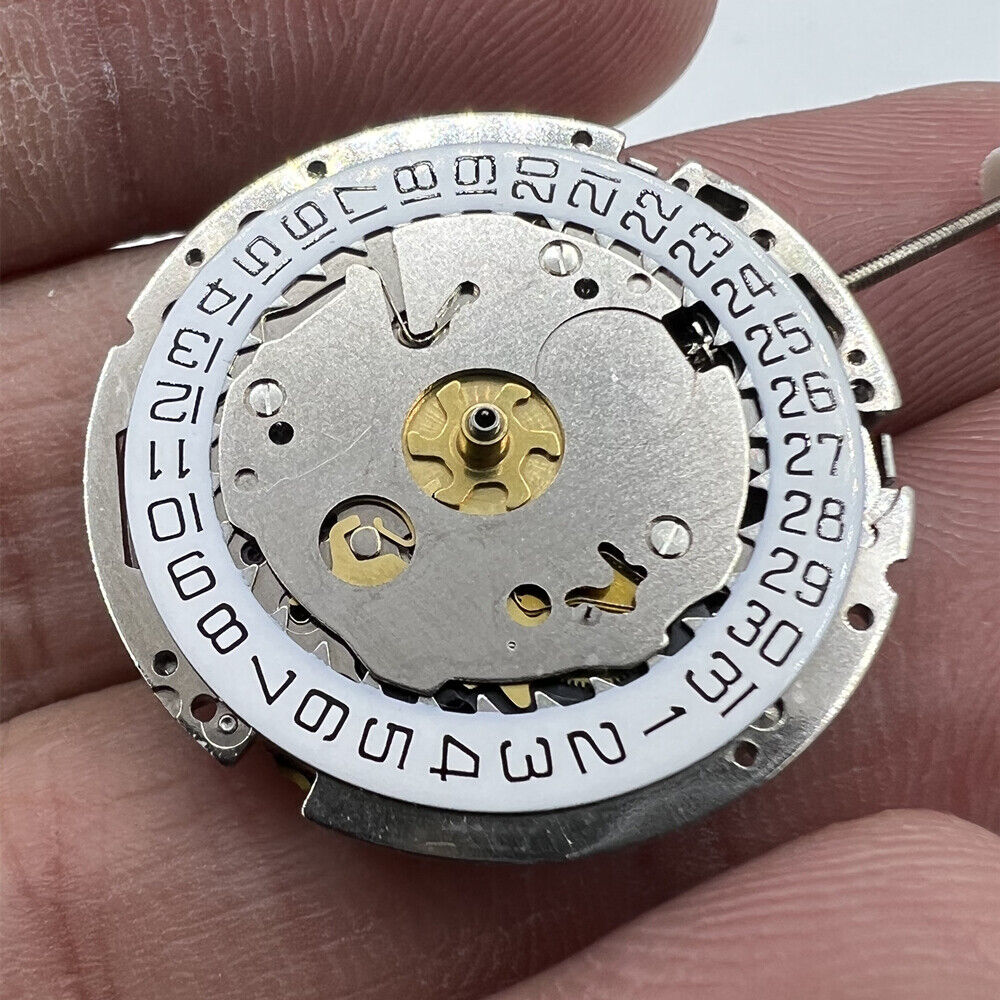 Genuine Swiss ISA 8161 silver quartz watch movement with 3 hands and date at 4, ideal for repair and replacement.