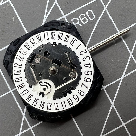VX22 quartz watch movement with date at 3 and 6 o'clock, white disk, Japan made by Seiko.