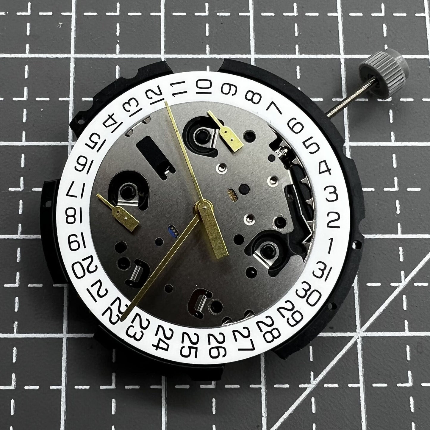 ETA G10.212 quartz watch movement showing three hands and date display by ETA brand.