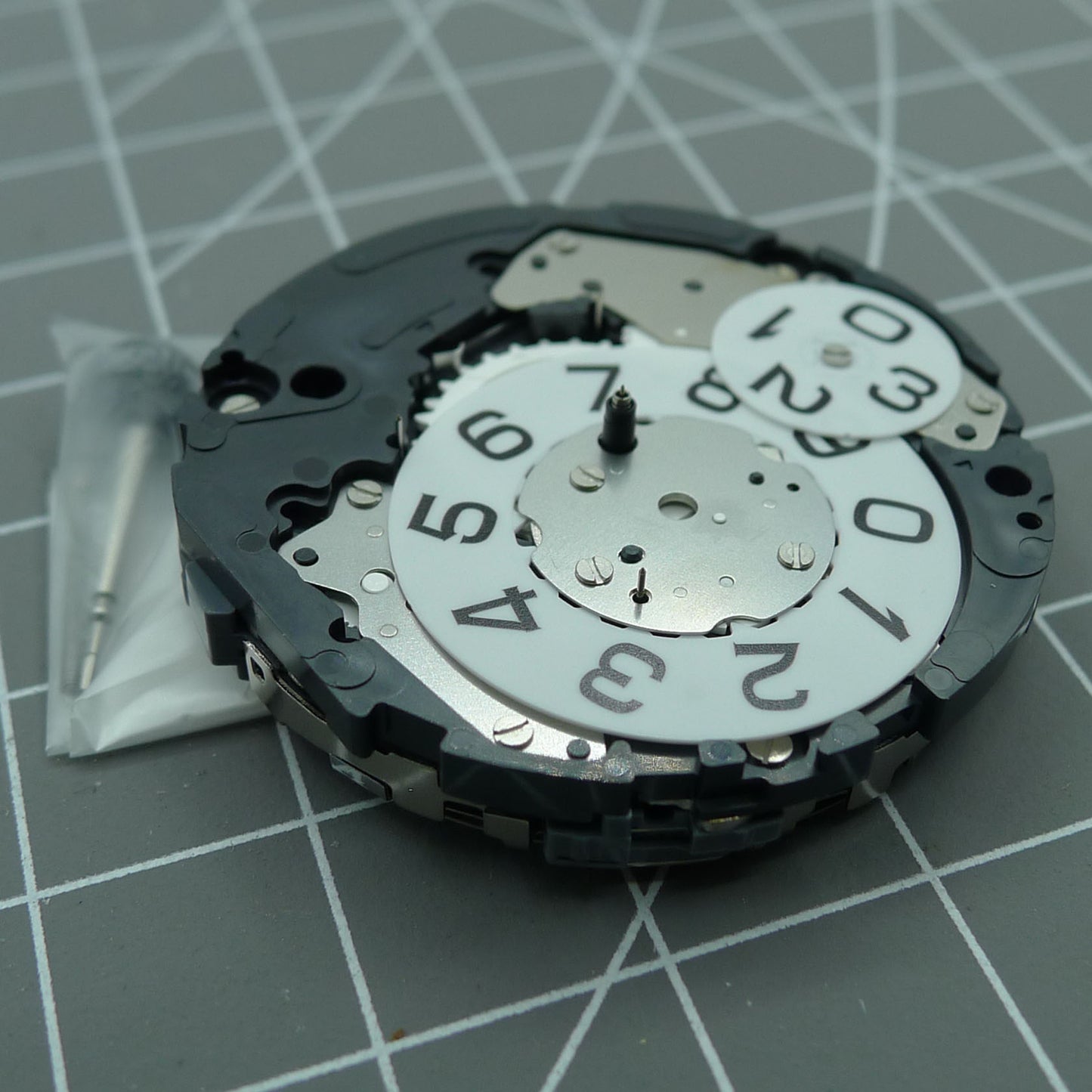 Miyota 6S50 quartz watch movement showing date at 12, small seconds at 3, 6, and 9 positions