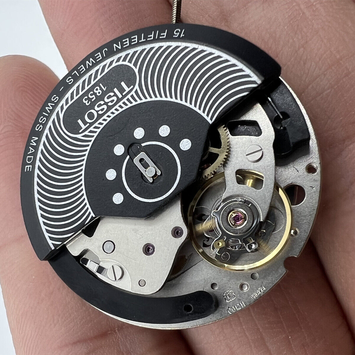 Tissot ETA C01.211 chronograph movement with black dial, precision mechanical watch accessory for timing.