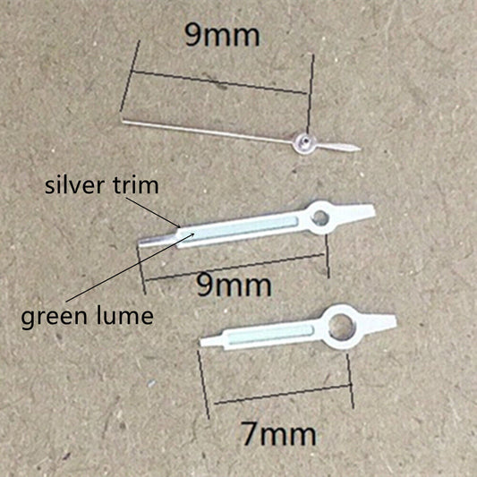 9mm silver-trimmed green lume watch hands for Miyota 1M12 movement, enhancing readability and style.