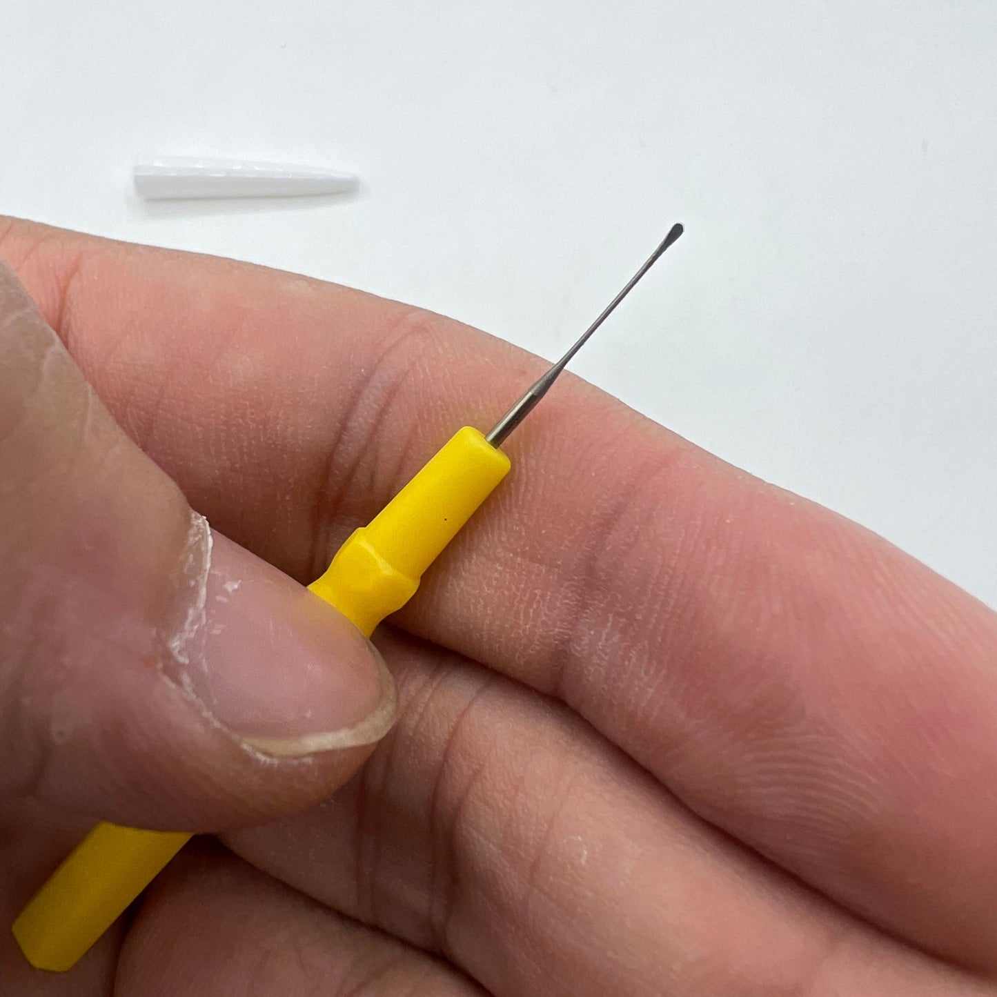 Bergeon 30102-D yellow watch dip oiler for precise Swiss watch repair and maintenance.