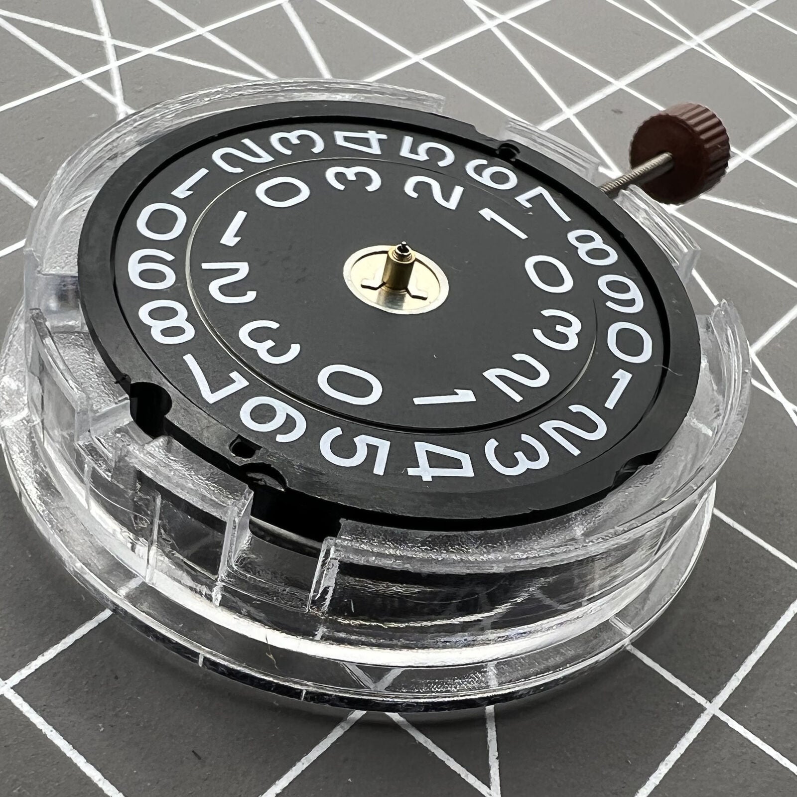 Swiss Ronda 509 quartz watch movement with black disk date at 3, precise timing for accessories.