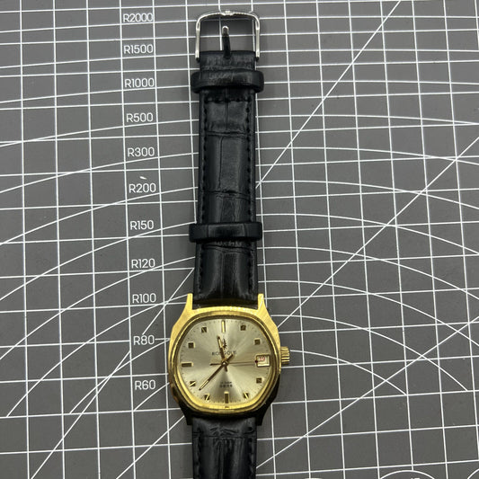 Black Dandong manual mechanical watch with 17 jewels, single calendar, and golden dial for classic elegance.