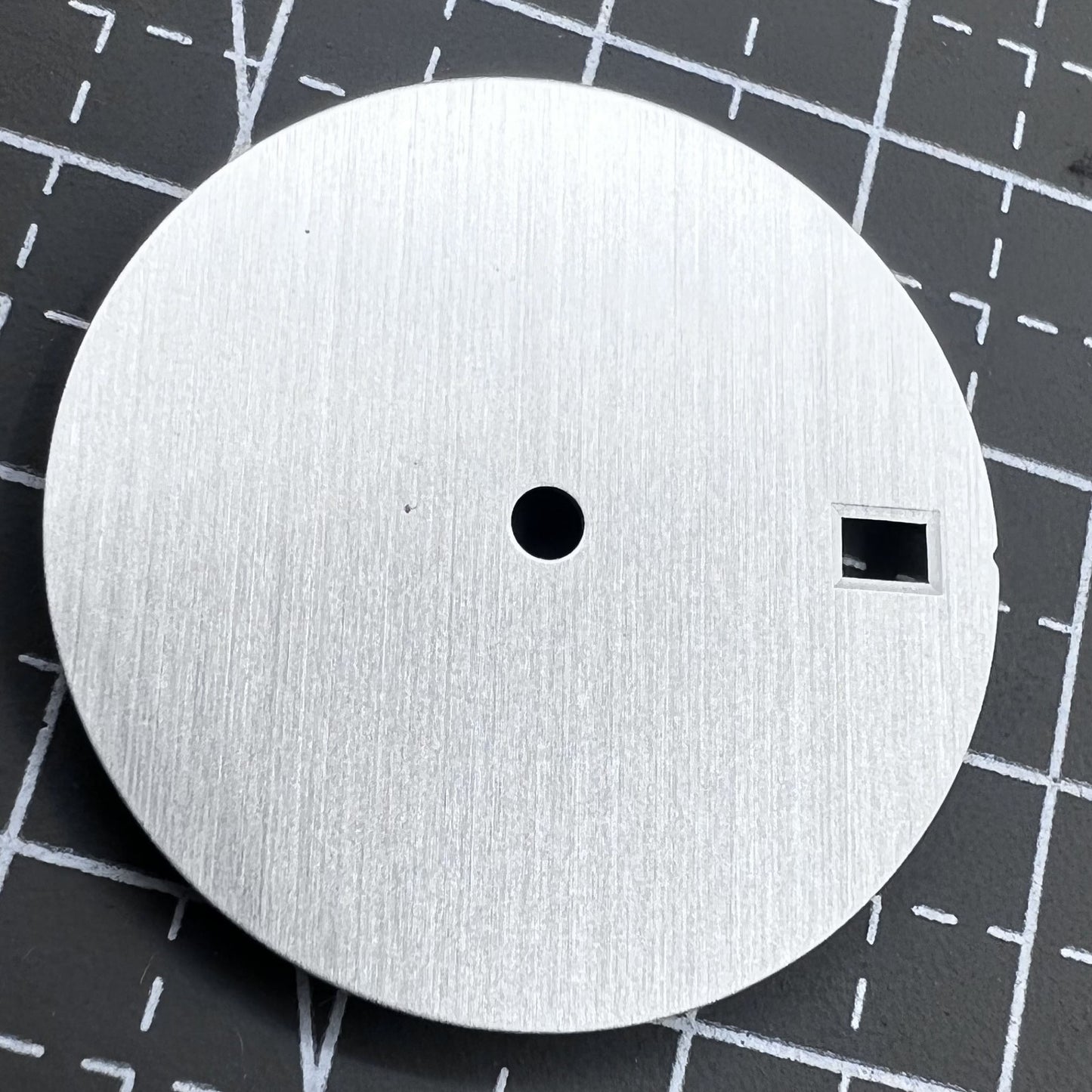 Silver 28.5mm watch dial with calendar, compatible with NH35/36 movement, precision-crafted for elegant timepieces.