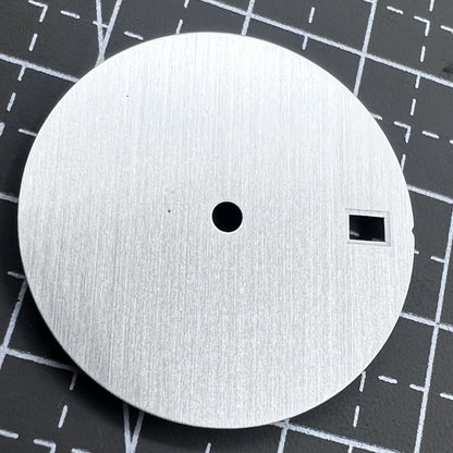 Silver 28.5mm watch dial with calendar, compatible with NH35/36 movement, precision-crafted for elegant timepieces.
