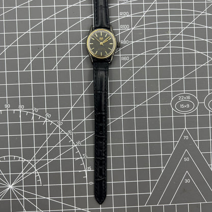 Seagull black case ladies watch with gold nail markers, manual mechanical movement, and shock resistance.