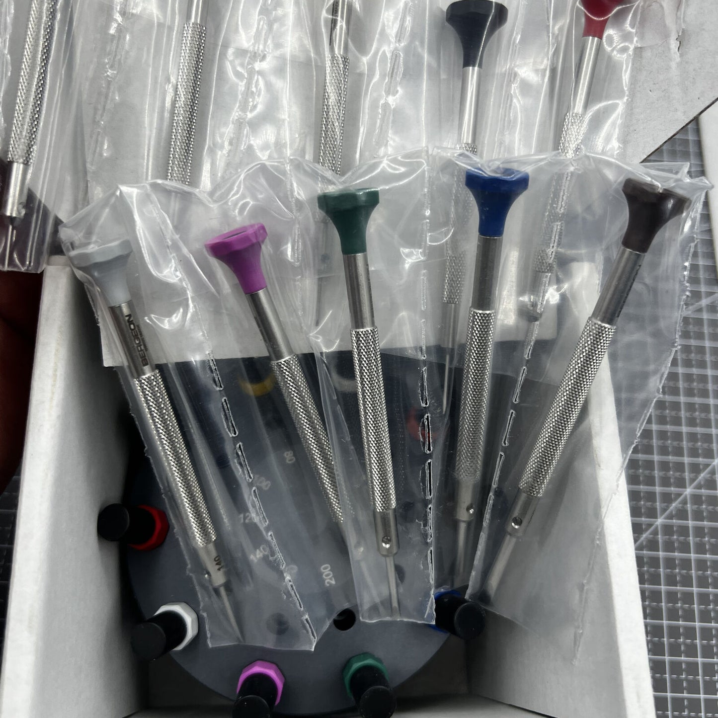 Swiss Bergeon 30081-S10 ergonomic screwdriver set with rotating stand for precise watch repairs and adjustments.