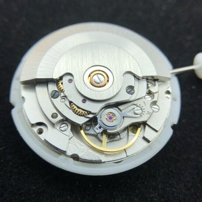 China Made 2834-2 mechanical watch movement displaying double calendar with date at 3 o?clock and day at 12 position.