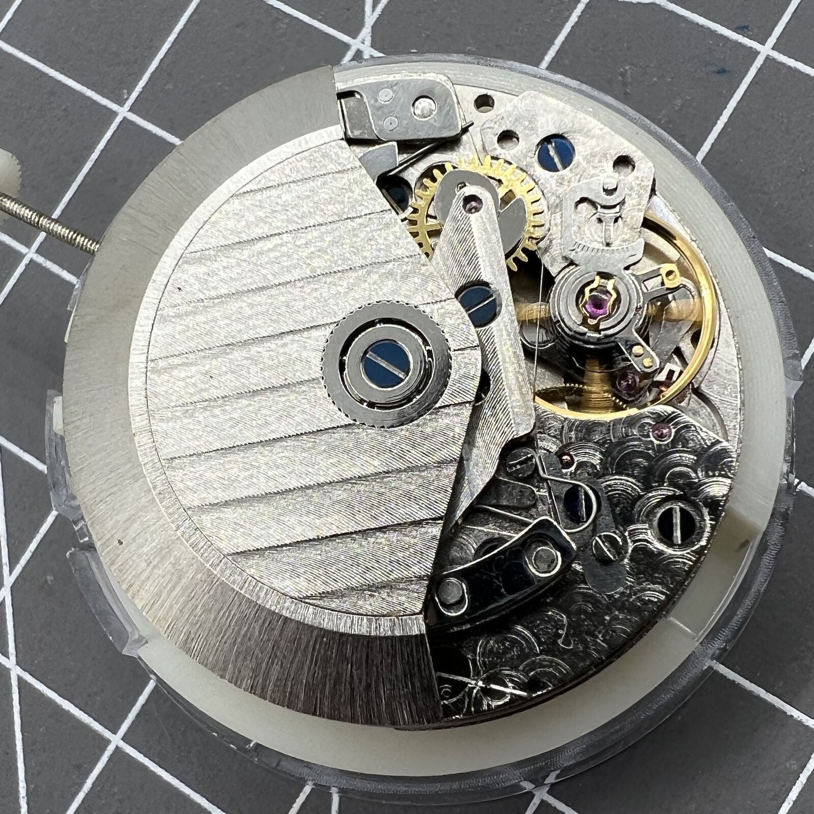 Automatic chronograph watch with ETA 7750 movement, black dial, calendar at 4:30, precision timing.