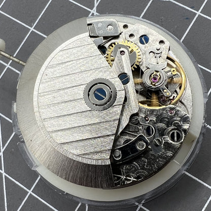 Automatic chronograph watch with ETA 7750 movement, black dial, calendar at 4:30, precision timing.