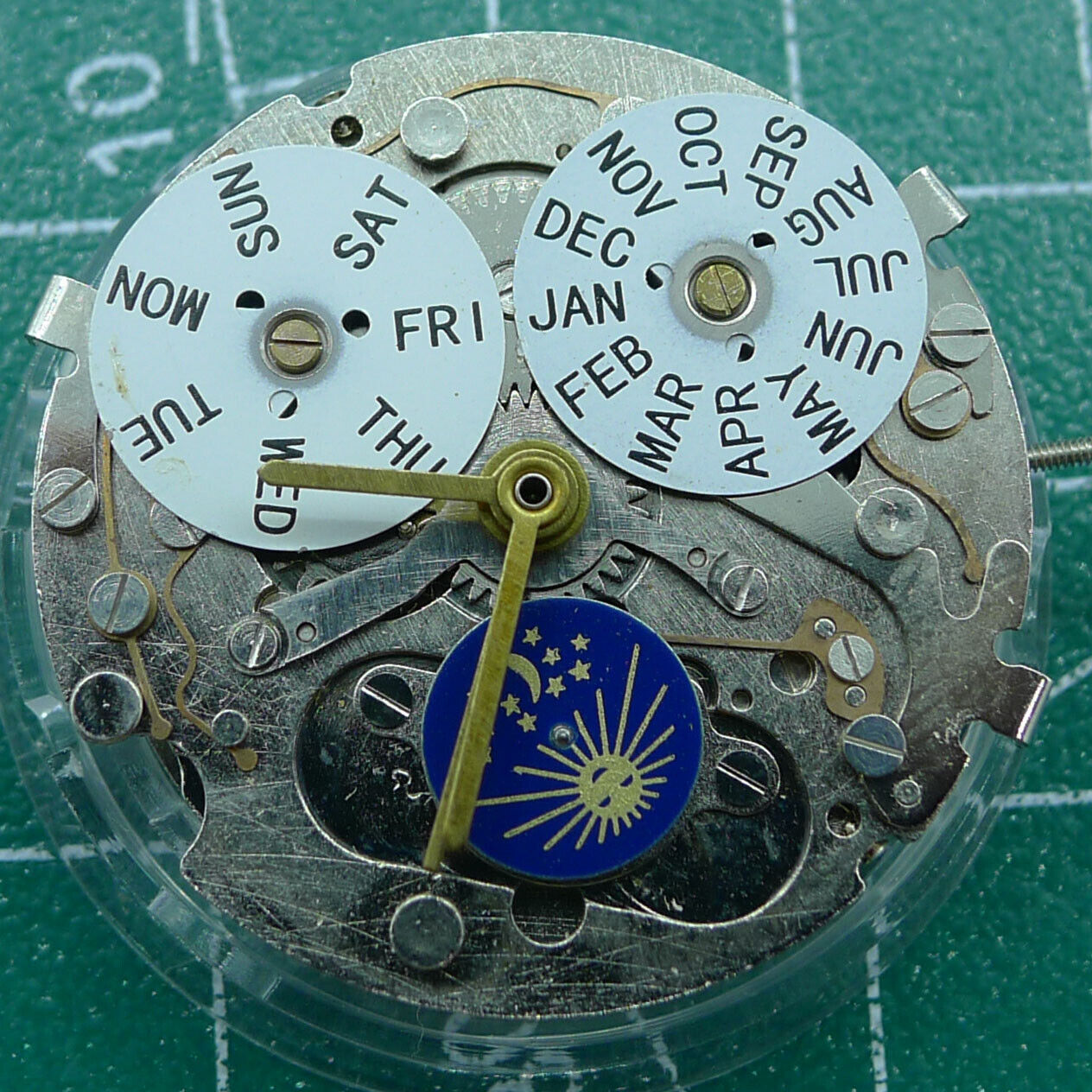 Automatic mechanical watch with week/month indicators at 12 o'clock, moon phase at 6, perfect for collectors.