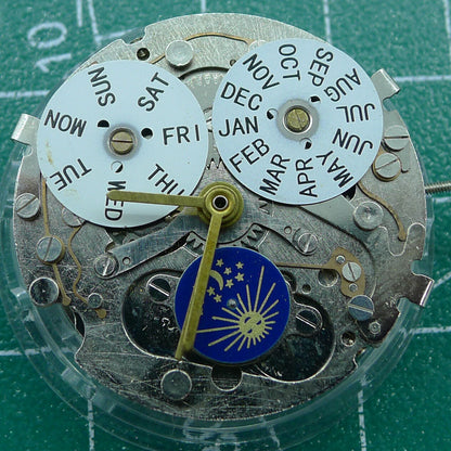 Automatic mechanical watch with week/month indicators at 12 o'clock, moon phase at 6, perfect for collectors.