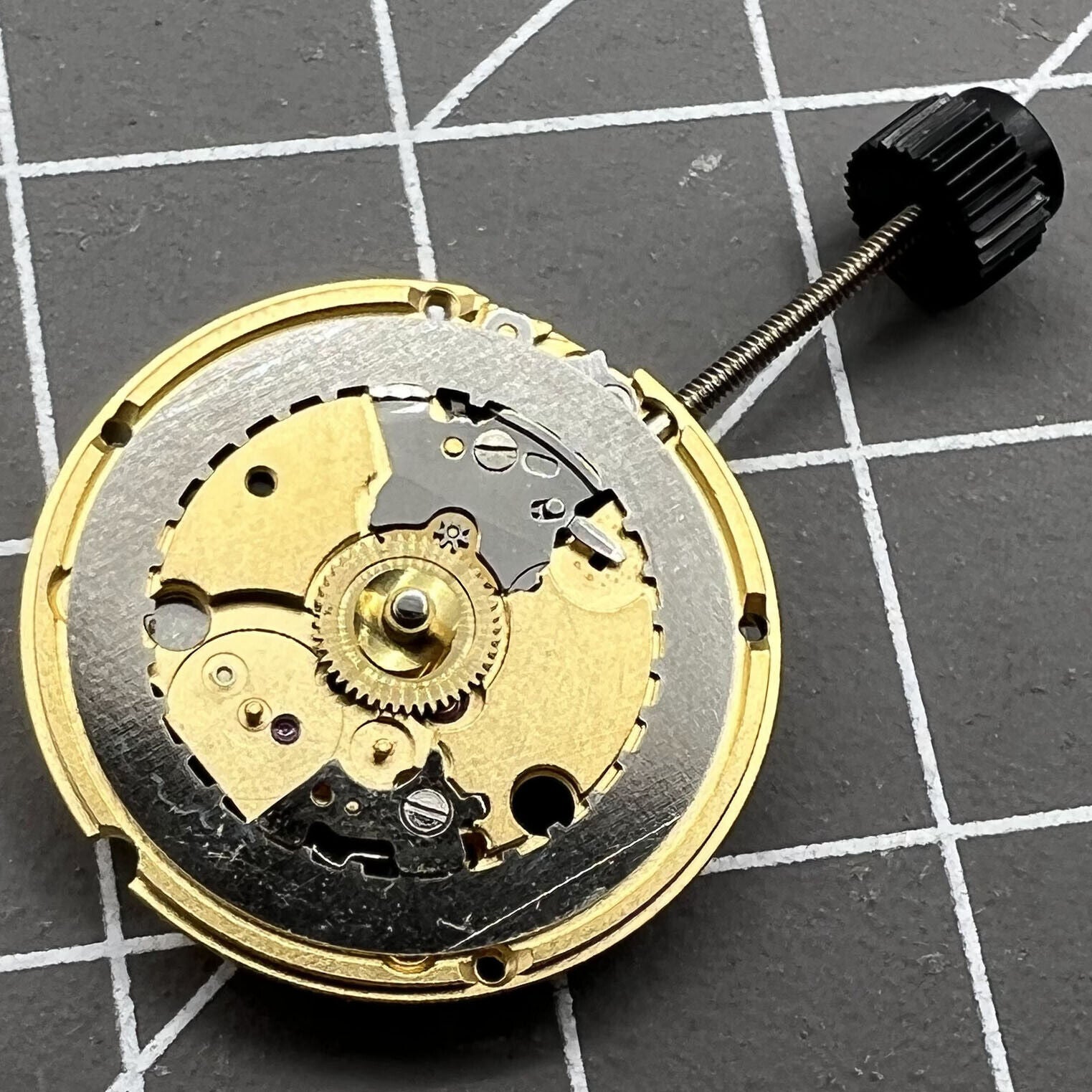 Swiss Made ETA 956.032 quartz watch movement with two hands, showcasing precise Swiss craftsmanship by ETA.