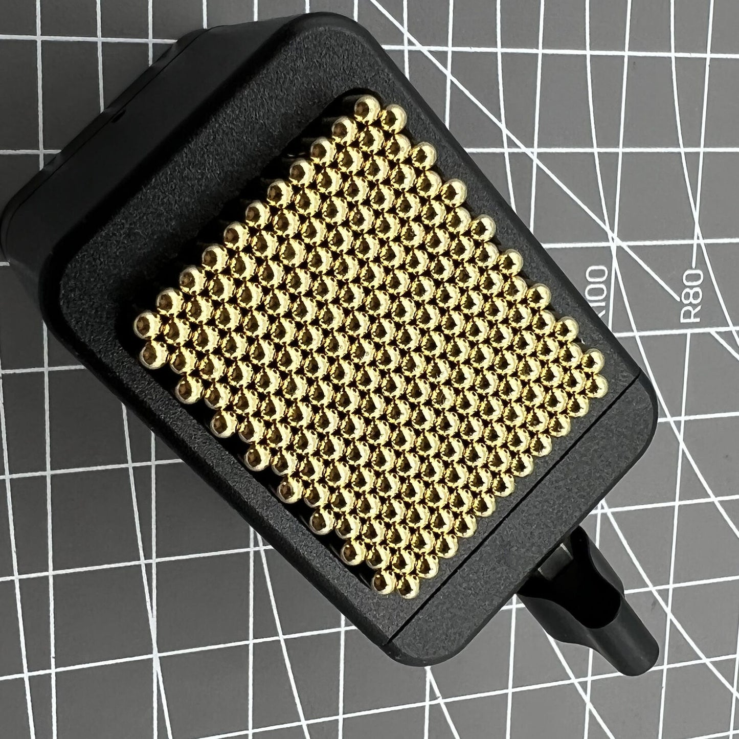 Universal China metal beads holder securing various watch movement shapes for precise repair and assembly.