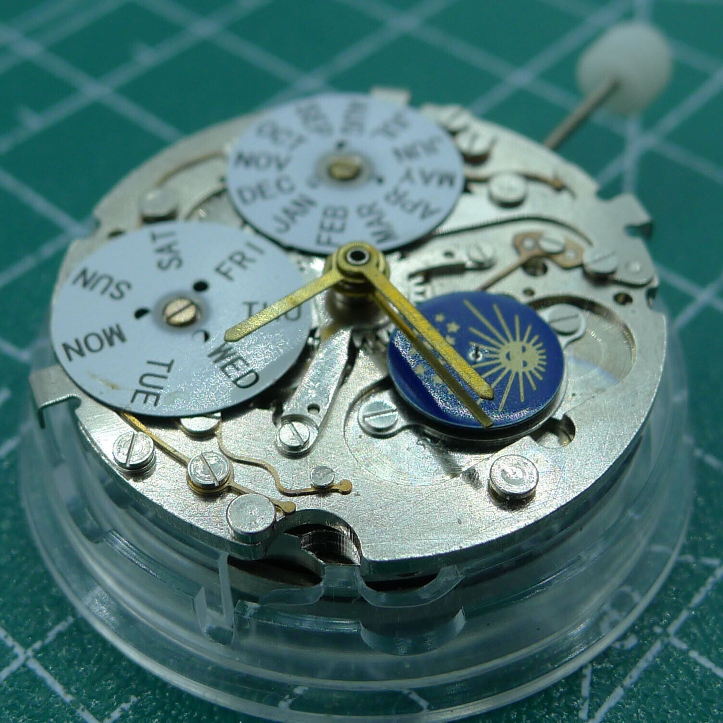 Automatic mechanical watch with week/month indicators at 12 o'clock, moon phase at 6, perfect for collectors.