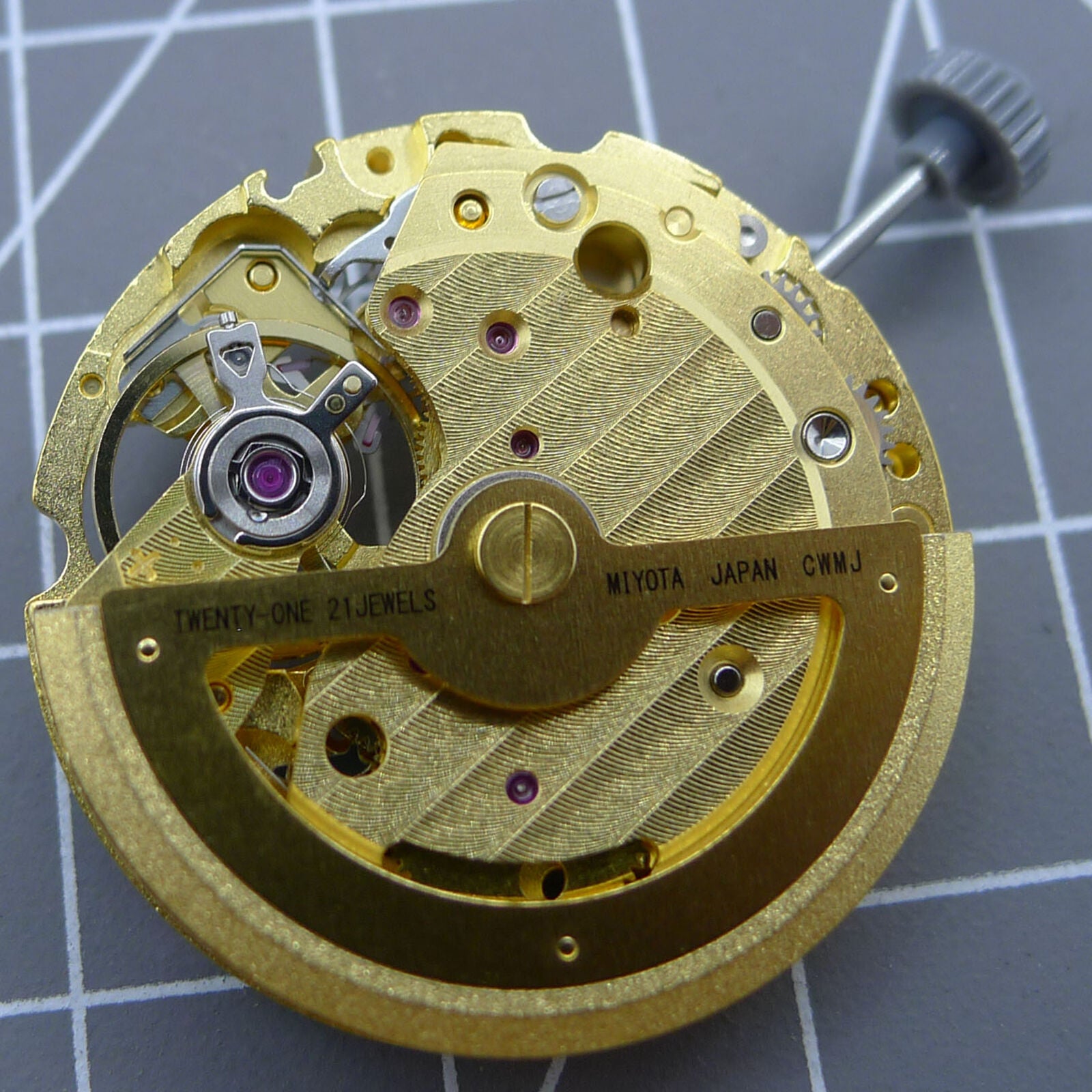 Gold 82S0 Miyota automatic watch movement by CITIZEN, precision mechanical component for luxury watches.