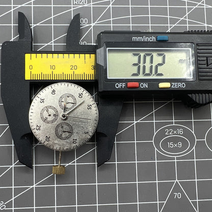 Detailed view of China Made 7750 automatic chronograph movement with ETA 7753 layout and subdials at 3, 6, 9 o'clock.