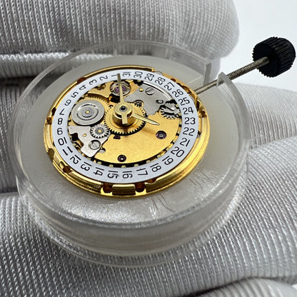 Gold mechanical watch with date display at 3 o'clock, compatible ETA2671 replacement part.