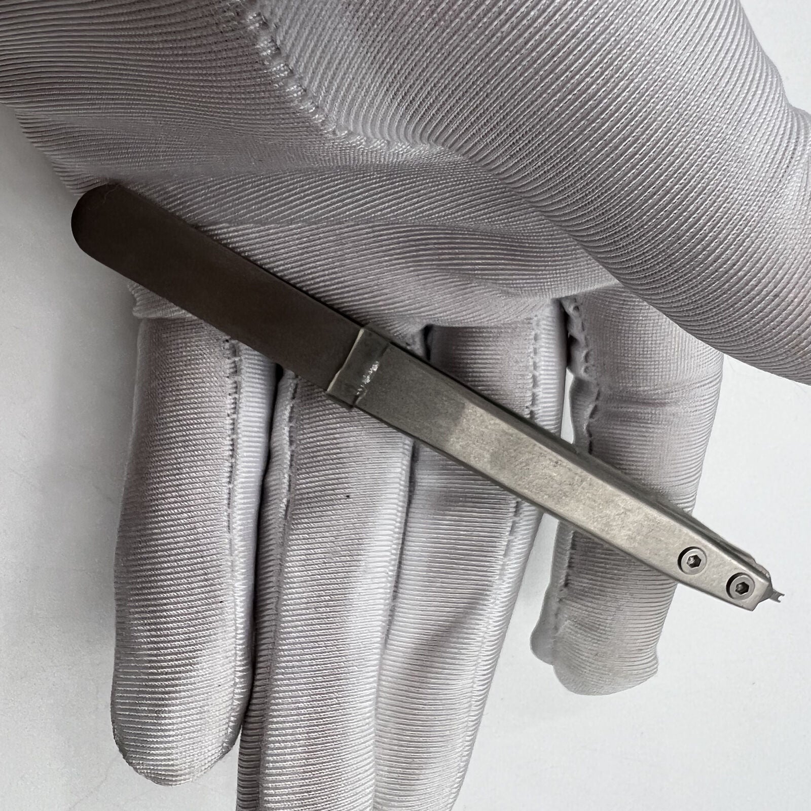 Precision Bergeon 7825 spring bar tweezer for watch lug removal and fitting accessories.