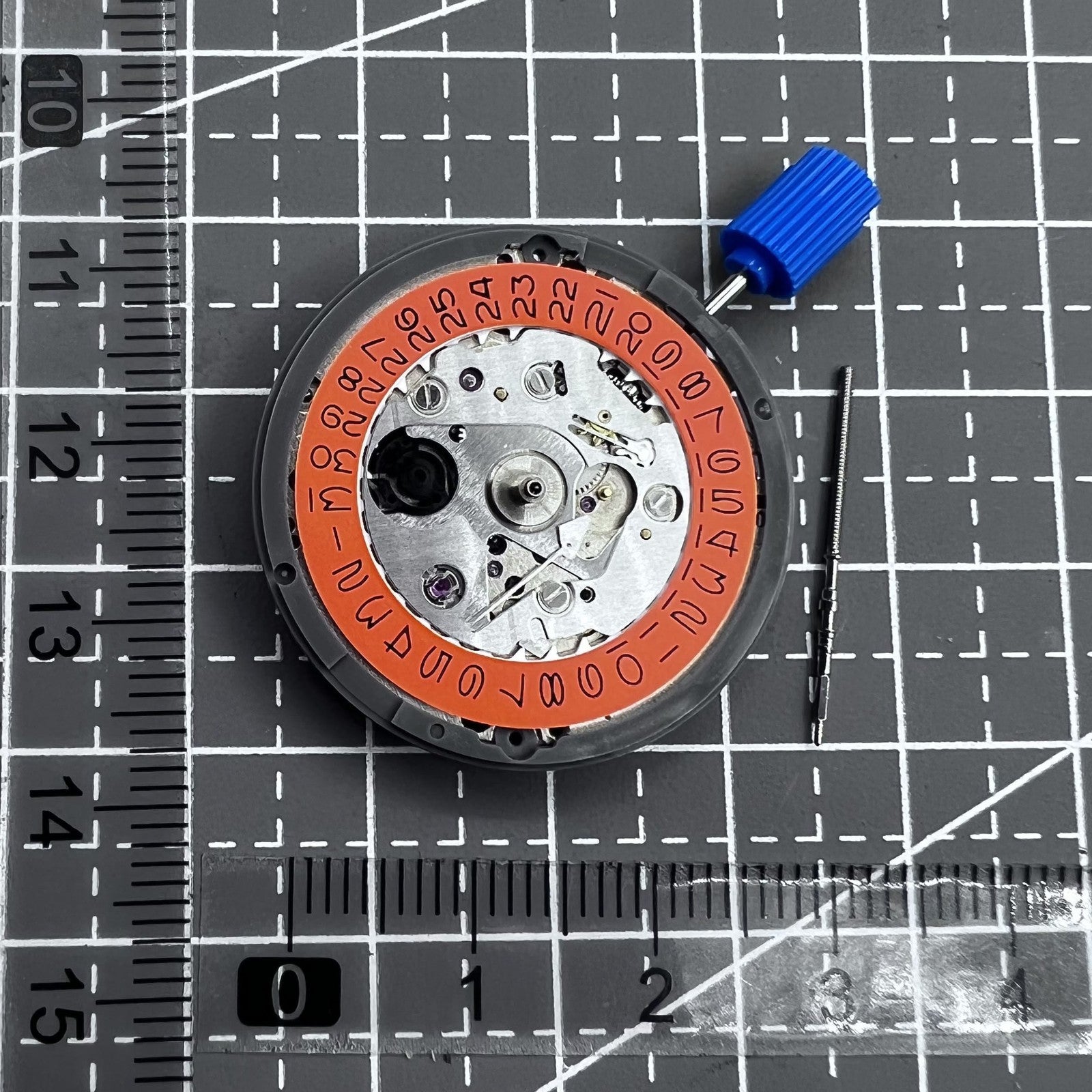 Seiko NH35 automatic watch movement with high precision and vibrant orange dial, ideal for watch repairs.