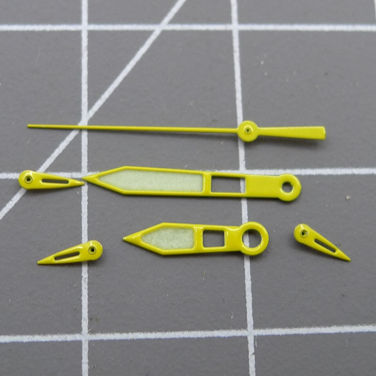 Yellow-trimmed green lume watch hands for Miyota OS10 and 0S10 movements, precise accessory.