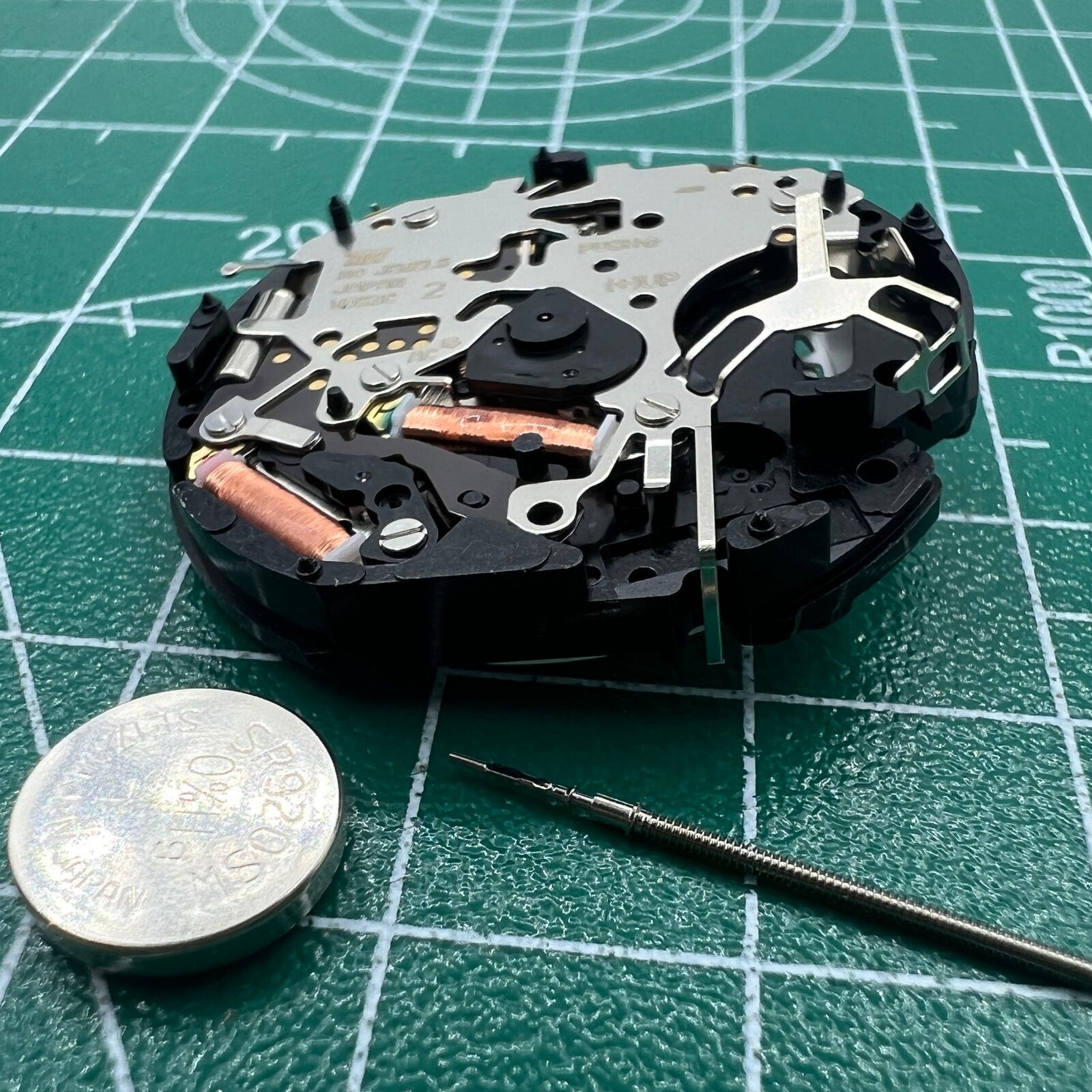 Hattori Epson TMI VD53C quartz watch movement showing date display at 6 o'clock for precision timekeeping accessories.