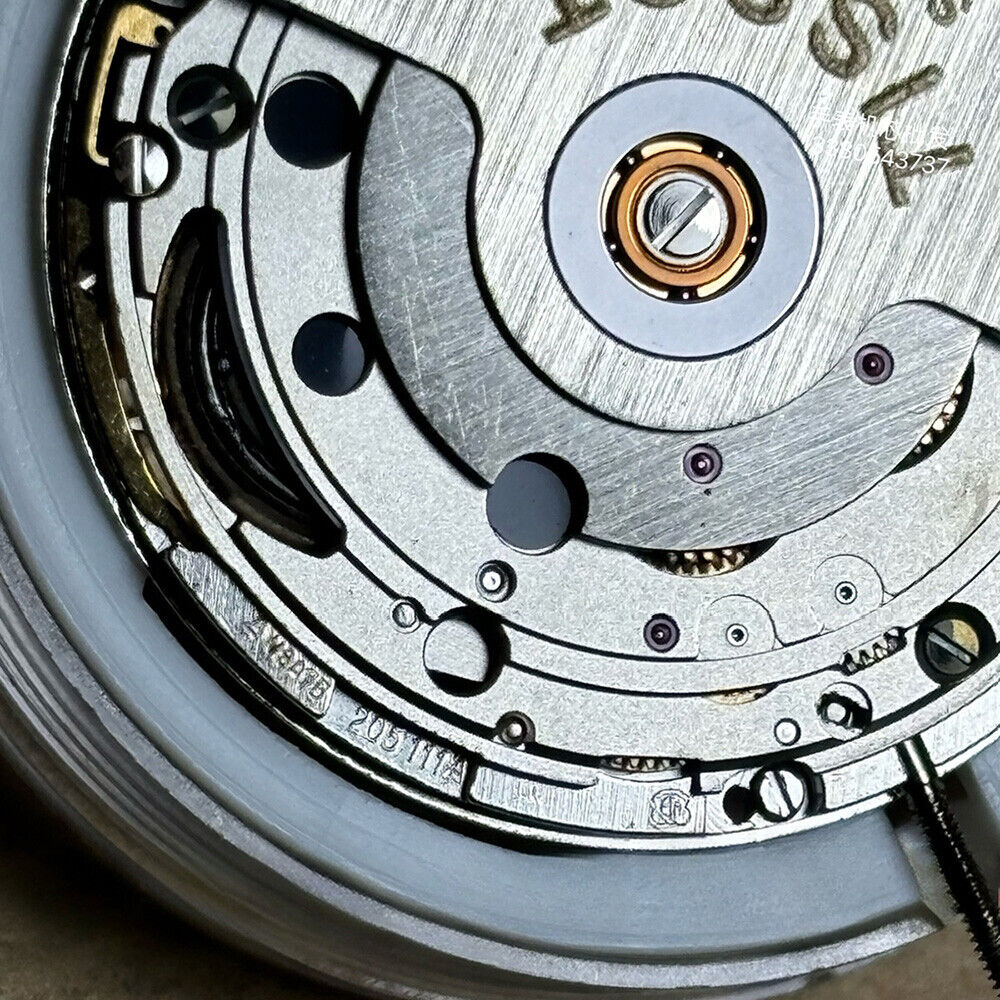 Swiss Made ETA 205.111 watch movement with silver finish and kinetic energy for accurate timekeeping by ETA.