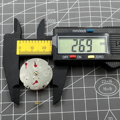 26.5mm Dandong 7120 automatic watch movement with day-date function, precise timekeeping for watch repairs.