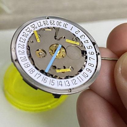 Silver ISA8171 watch accessories with ISA 8161 quartz movement, date at 6, white disk, and six hands.