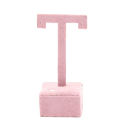 Earring display stand with hanging hooks, decorative jewelry organizer shelf.