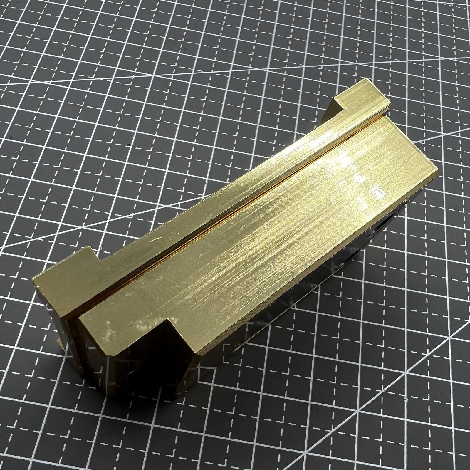 Brass-handled stainless steel pegwood tool by Woodcutter for precise watch cleaning and intricate detailing.