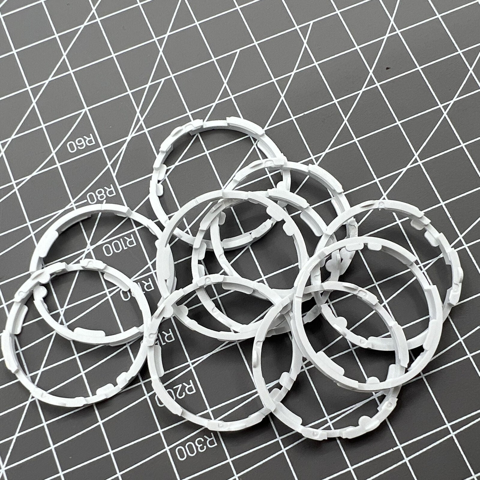 Set of 5 Miyota 8200 series movement cushion spacer rings for precise watch assembly.