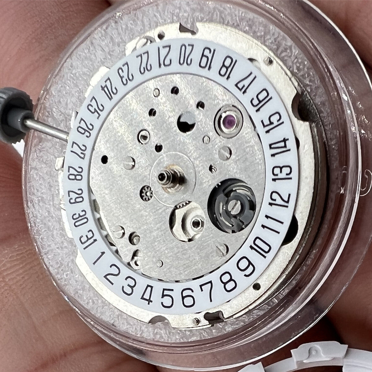 Miyota/Citizen 8215 silver plated automatic watch movement showing date at 6, Japanese precision craftsmanship