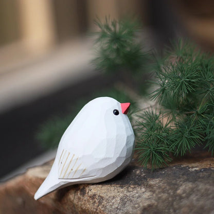 Handmade white pearl bird wooden figurine, charming decorative artwork for home display.